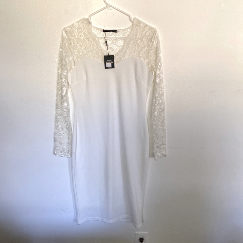Musol brand dress, all white with lace upper and sleeves, form fitting.